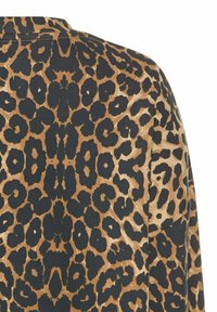 Leopardenmuster-Stoff mit einer Mischung aus schwarzen Flecken auf einem hellbraunen Hintergrund, mit einer weichen Textur und einem symmetrischen Design über der gesamten Fläche.