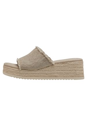 Beige wedge sandals with textured linen upper and frayed edges. Rope-wrapped platform sole with a rubber base, zigzag tread pattern.