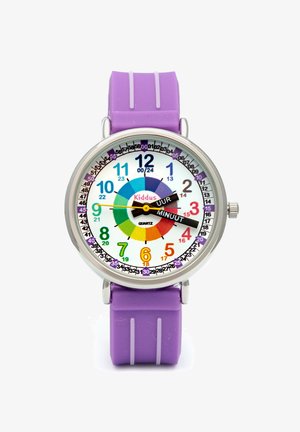 Reloj colorido con una esfera blanca, correa de goma morada, manecillas de horas y minutos, y números en negrita. Presenta un diseño de rueda de colores del arcoíris.