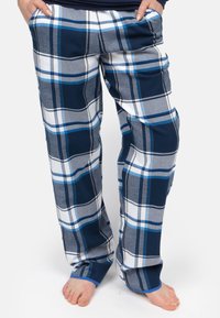 Granatowe, szare i białe spodnie dresowe w kratę. Wykonane z miękkiego flaneli, charakteryzują się luźnym krojem i elastycznym pasem.