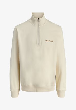 Krém színű hosszú ujjú pulóver negyedig cipzárral az elején, bal mellrészen barna "Originals Studio" hímzéssel.