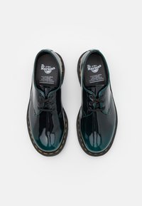 dr martens vegan gloss green