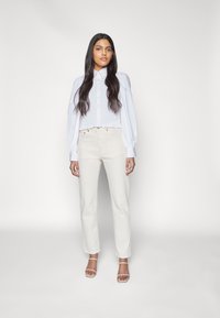 Levi's® CROP - Calças de ganga de perna direita - natural order