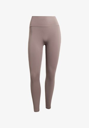 Kõrge vöökohaga retuusid tuhmjasmauvast toonist, mis on valmistatud siledast, venivast kangast ning millel on mugavuse ja paindlikkuse tagamiseks lamedad õmblused.