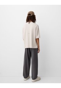 Bershka Teplákové kalhoty - mottled grey