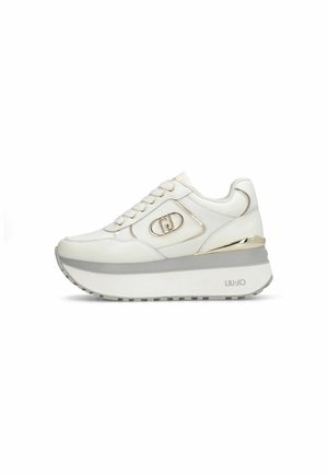 White platform sneaker with metallic gold accents, side logo, lace-up front, and thick rubber sole marked "LIU•JO" on heel.