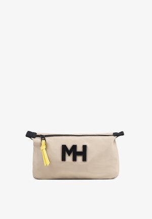 Bolsa rectangular beige con logo MH negro, cremallera negra y tira de cremallera amarilla sobre fondo blanco.