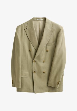 Blazer beige croisé avec revers à pointe, six boutons marron, trois boutons de manchette et deux poches avant, présenté sur fond blanc.