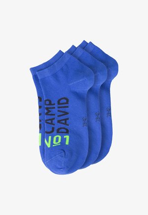 Four pairs of blue ankle socks with "CAMP DAVID" text printed in black and neon green on the front side, stacked together.