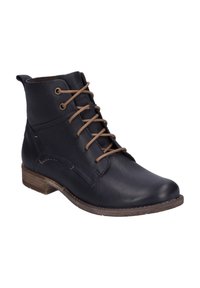 Bottine en cuir noir avec des lacets marron et un faible talon en bois, présentée à un angle léger sur un fond blanc.