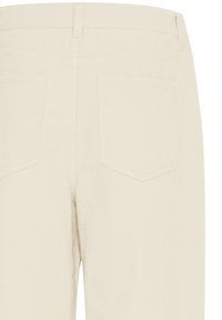 Vue arrière d’un pantalon en velours côtelé beige avec deux poches arrière et des passants de ceinture à la taille.