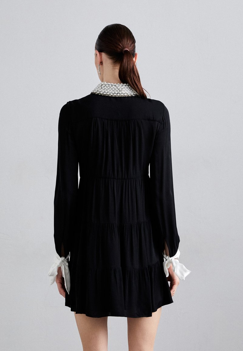 meeko embroidered ruffled sleeve shirt dress Ivory White Eyelet Ruffled Mini Graduation Dress Ivory White / Large main image 0