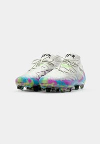 White soccer cleats with a colorful tie-dye pattern in pink, blue, and green. Features lace-up design and textured upper material.