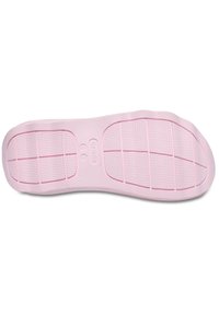 Różowa gumowa podeszwa z teksturowaną powierzchnią, z siatką dla lepszej przyczepności oraz detalem logo. Gładkie wykończenie z zaokrąglonymi krawędziami.