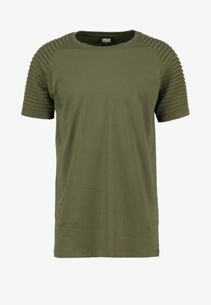 Olīvzaļš T-krekls ar īsām piedurknēm, ar ribu detaļām uz pleciem, apaļu kaklu un standarta piegriezumu. Kokvilnas materiāls.