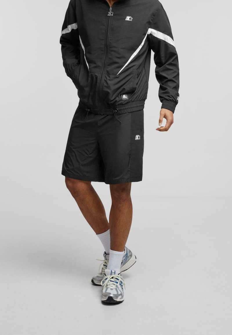 Starter Black Label Loosefit Pantaloni in Nero | ABOUT YOU