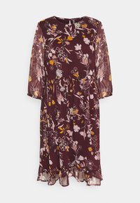 Viininpunainen kukkakuvioinen mekko, jossa on pitkät läpikuultavat hihat, pyöreä pääntie ja röyhelöhelma; mekossa on monivärinen kukkakuviointi ja vyötärösauma.