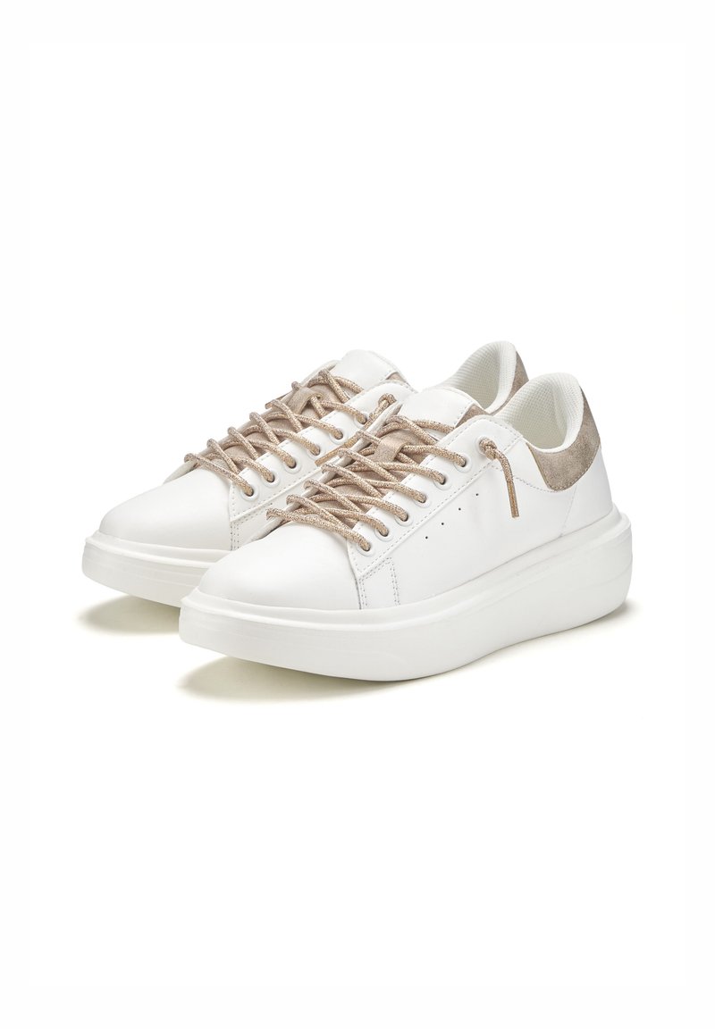 White sneakers with textured beige suede accents, round toe, flat sole, and metallic laces. Smooth upper surface, minimalist design.