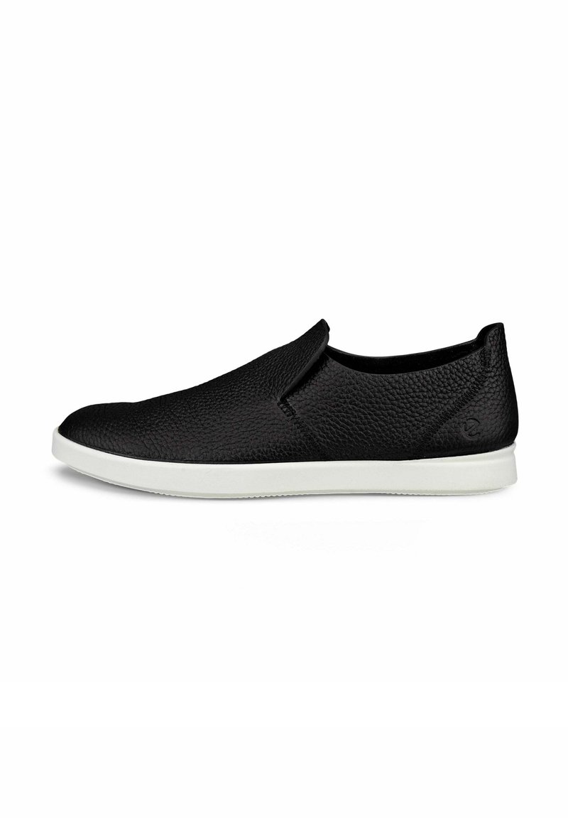 Scarpa nera in pelle elastica con superficie texturizzata, suola in gomma bianca e design minimalista. Nessun lacci o abbellimenti visibili.