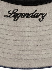 Gray cap with black embroidered "Legendary" text. Smooth texture with layered ridges on the front, and a dark blue accent along the brim.