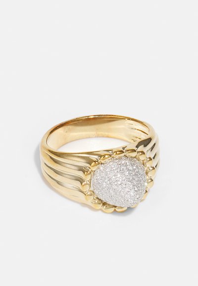 Gold ring with textured band and a prominent, glittering silver dome at the center, featuring a smooth, polished finish.