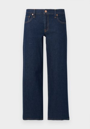Jean bleu foncé droit avec bouton et fermeture éclair à l'avant, cinq poches et coutures orange visibles sur fond gris.