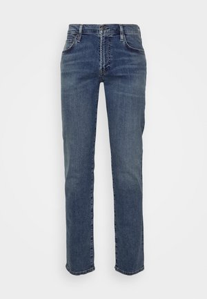 Sinisistä denimmateriaaleista tehdyt suoralahkeiset farkut, joissa on tavalliset taskut sekä klassinen nappi- ja vetoketjusuljenta. Siisti viimeistely ja minimaalista kulumista.