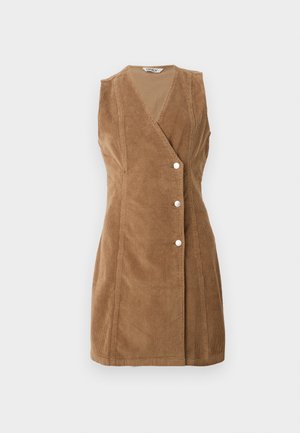 Brown corduroy sleeveless dress featuring a wrap design, four button accents, and visible stitching along the edges.