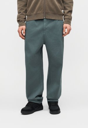 Kaotiko FOCUS ON THE GOOD - Nohavice - teal