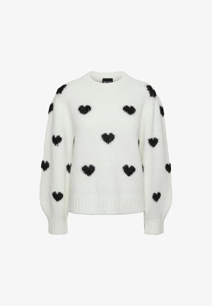 Bijela krznena pulover sa dugim napušenim rukavima, ukrašena ravnomjerno raspoređenim crnim srcima na prednjem dijelu i rukavima.
