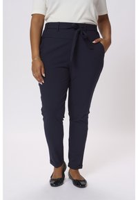 Mørkeblå skræddersyede bukser med knyttet talje, slim fit, sidelommer og oprevne leggings. Lavet af glat stof, velegnet til både afslappet og formelt brug.