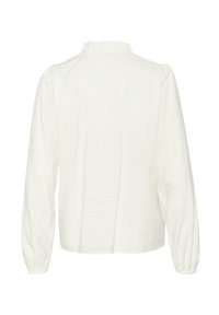 White long-sleeve top with a textured fabric, featuring a ruffled neck, slightly puffed sleeves, and a relaxed fit. Back view shown.
