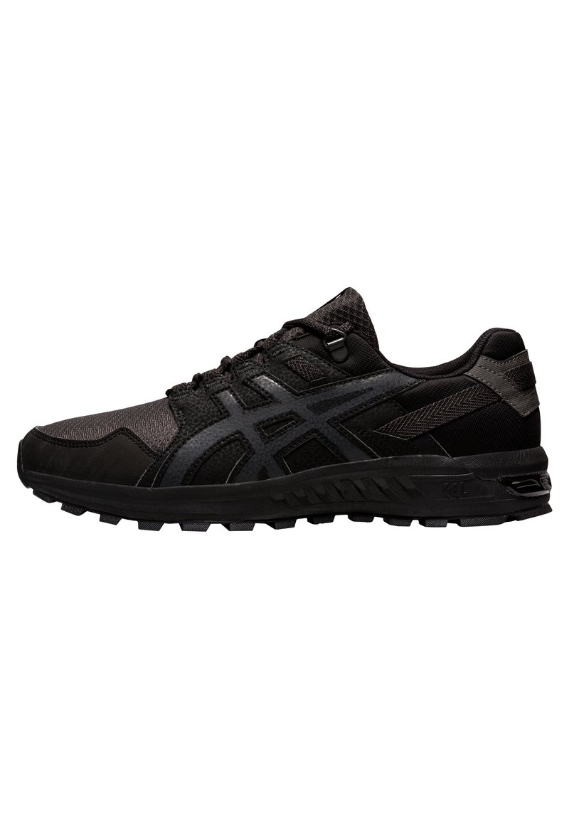 Black athletic shoes with mesh and synthetic upper, textured detailing, lace-up closure, and rugged rubber sole with traction patterns.