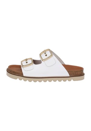 Hvide slippers med to justerbare guldbeslag, korkfodbed og en tekstureret gummisål med bølgedesign.