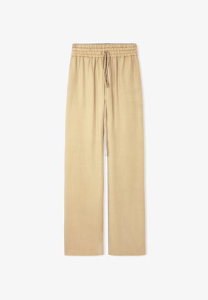 Beige Schlaghosen mit einem elastischen Bund und Kordelzug. Der Stoff wirkt glatt mit einer subtilen Textur und ohne sichtbare Muster.