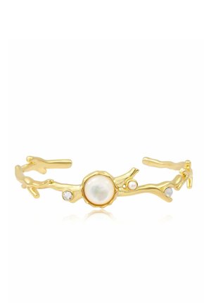 Bracelet manchette ouvert couleur or avec un design en forme de branche, orné d'une grande perle centrale et de petites perles et cristaux.