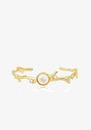Bracelet manchette ouvert couleur or avec un design en forme de branche, orné d'une grande perle centrale et de petites perles et cristaux.