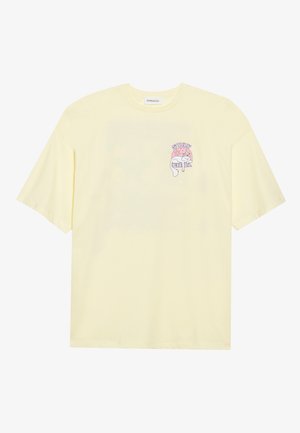 Yellow cotton t-shirt with short sleeves and a round neckline. Features a graphic print on the left chest reading "STAY CHILL."