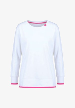 Biała koszula z długim rękawem z różowym obszyciem na mankietach, na dole i przy dekolcie, z małą różową metką w pobliżu kołnierzyka.