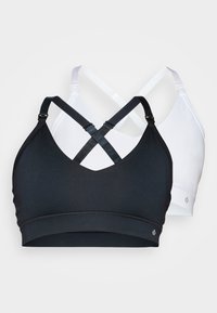 Svart og hvit bralette-sett med racerback-design, elastisk stoff, justerbare stropper, bånd under bysten og logo-detalj på siden.