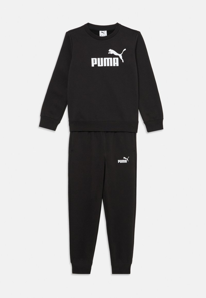 Melnas sporta bikses un sporta krekls komplektā, izgatavoti no mīkstas auduma. Sporta krekls priekšpusē ir ar balto "PUMA" logo un jaguāra detaļu, biksēm ir logo gurnā.