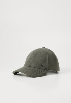 Green felt baseball cap with a curved brim and stitched detailing, featuring a small, embossed logo on the front.
