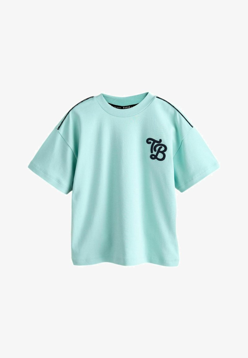 T-shirt en coton bleu clair à manches courtes, avec un logo "TB" noir brodé sur le devant et des coutures d'accent noires sur les épaules.