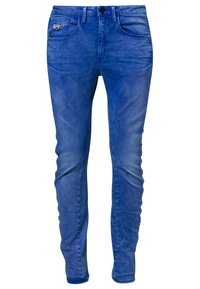Blå denim skinny jeans har en klassisk femficksdesign, en knappstängning och en lätt blekning för en sliten effekt.