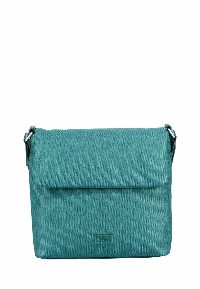 Teal crossbody bag with a textured finish, flap closure, and a logo on the front. Adjustable strap and sturdy fabric material.