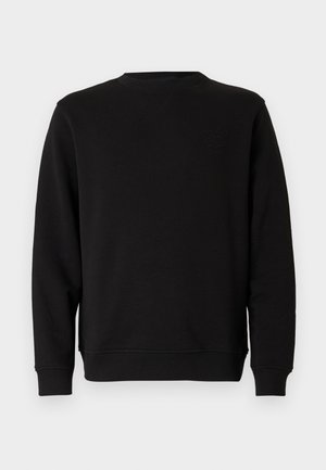 Sort sweatshirt med rund halsudskæring og ribbede manchetter. Har et subtilt broderet design på brystet. Fremstillet af blødt, struktureret stof.