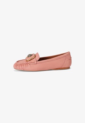 Soft pink leather flat loafer with gathered stitching at the front and a decorative gold and black emblem on the upper strap.