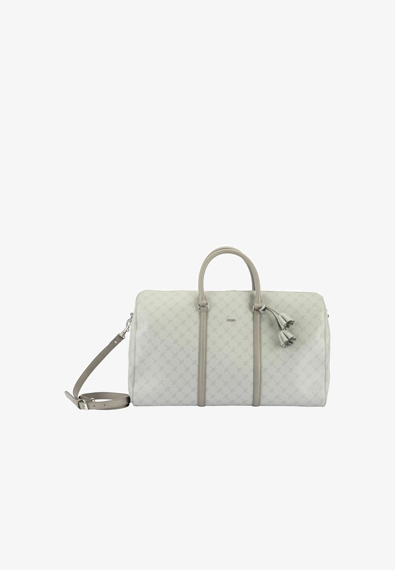 White faux leather duffle bag with light grey accents, dual handles, detachable shoulder strap, and decorative tassel. Features subtle pattern.