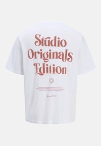 White cotton t-shirt featuring bold red text on the back that reads "Studio Originals Edition" with additional smaller text below.