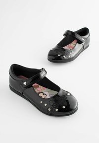 Svarta patenterade läderskor i Mary Jane-stil med rem, dekorerade med rhinestones och en dekorativ design, med en färgglad tryckt innersula.